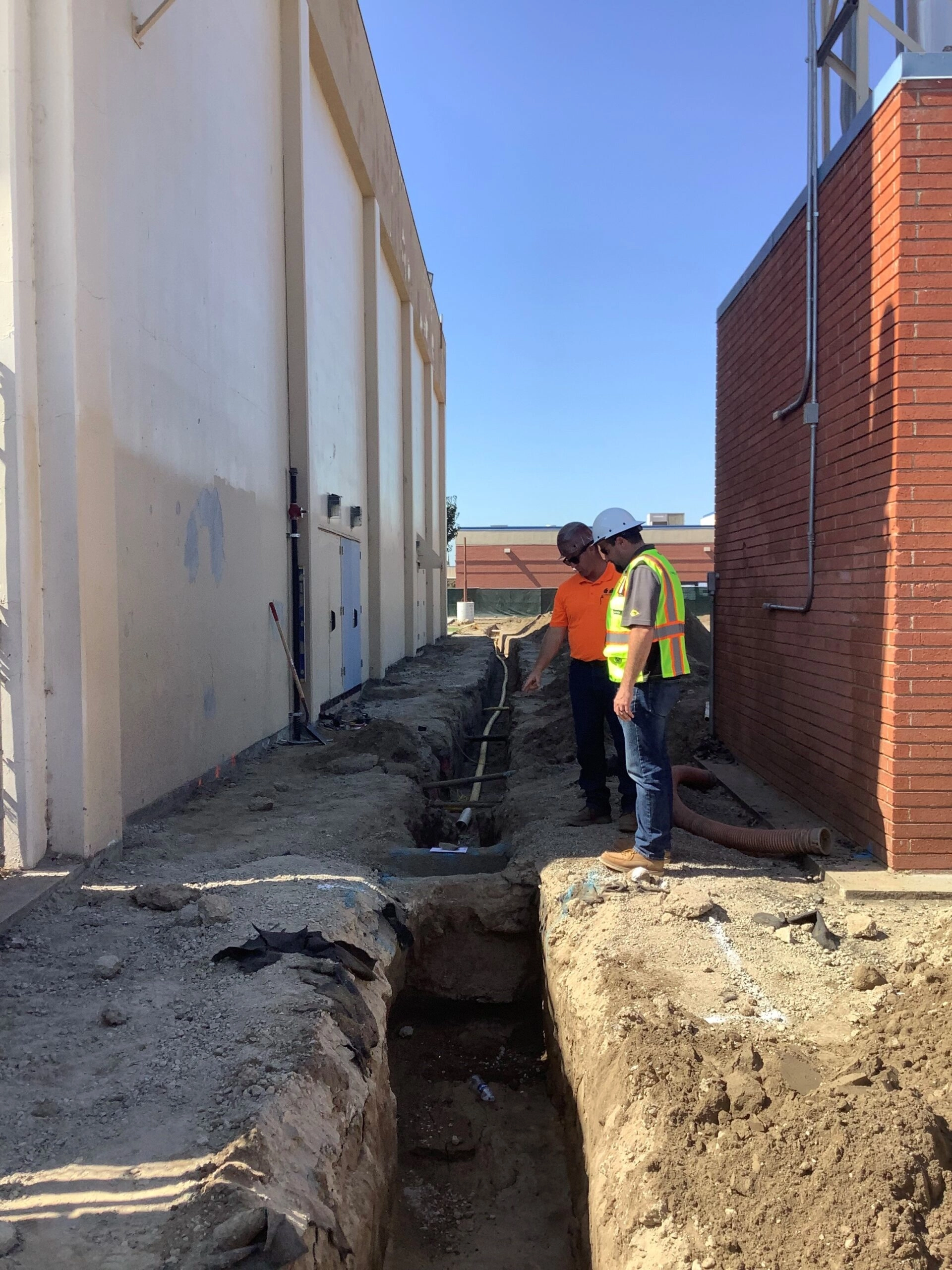 Workers inspecting construction site