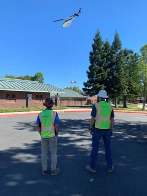 Workers flying a drone